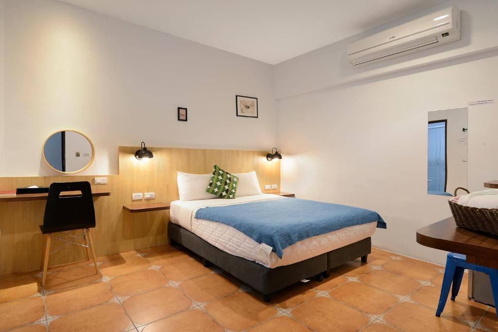 Postel nebo postele na pokoji v ubytování 康逸旅宿Comeinn2