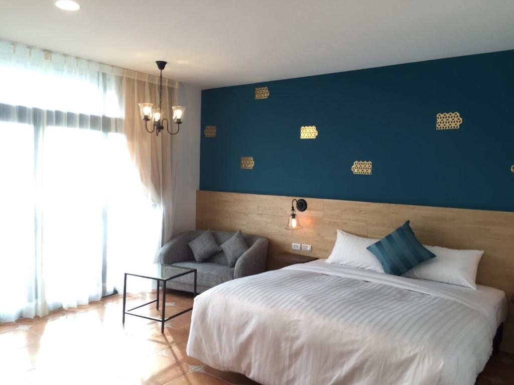 Postel nebo postele na pokoji v ubytování 康逸旅宿Comeinn2