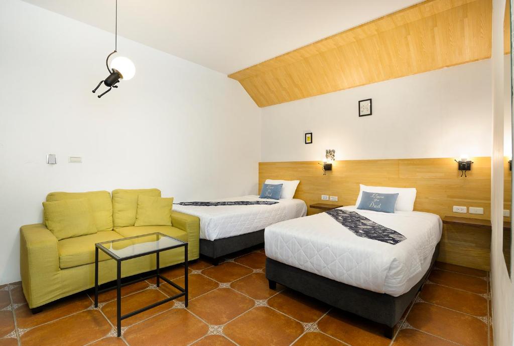 Postel nebo postele na pokoji v ubytování 康逸旅宿Comeinn2