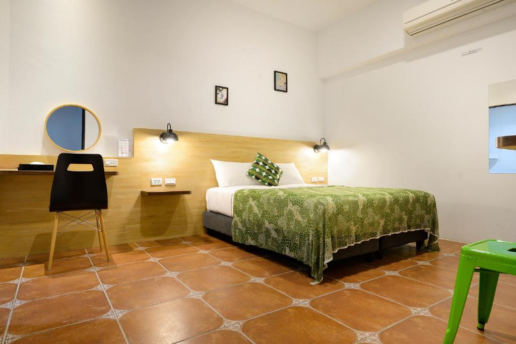 Postel nebo postele na pokoji v ubytování 康逸旅宿Comeinn2