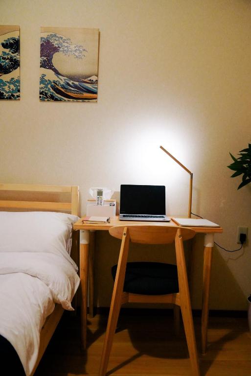 Postel nebo postele na pokoji v ubytování E JOY INN-West Shinjuku Branch