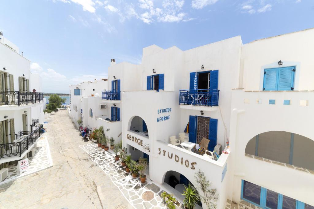 a view of a row of white buildings at George Studios in Naxos Chora