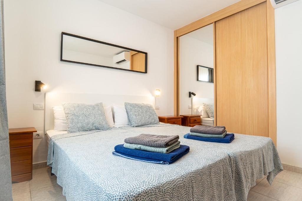 a bedroom with a bed with two pillows on it at Las Casitas de Corralejo in Corralejo
