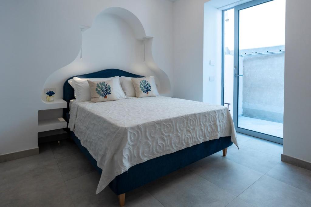 Postel nebo postele na pokoji v ubytování Amamì B&B