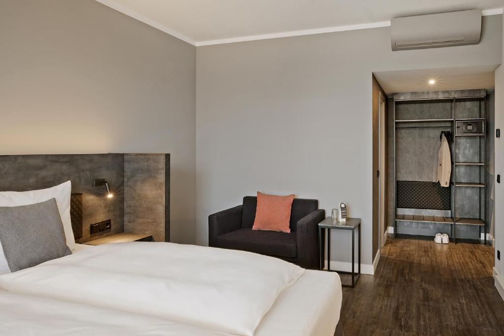 Postel nebo postele na pokoji v ubytování THE SCOTTY Hotel Hamburg