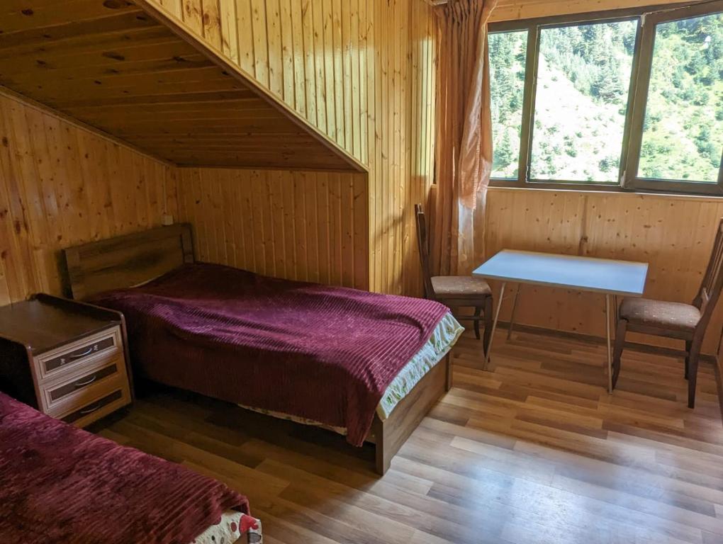 Postel nebo postele na pokoji v ubytování Doxturi's sakhli