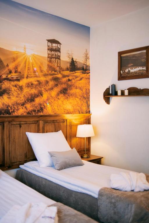 Postel nebo postele na pokoji v ubytování Hotel Kotarz Spa&Wellness