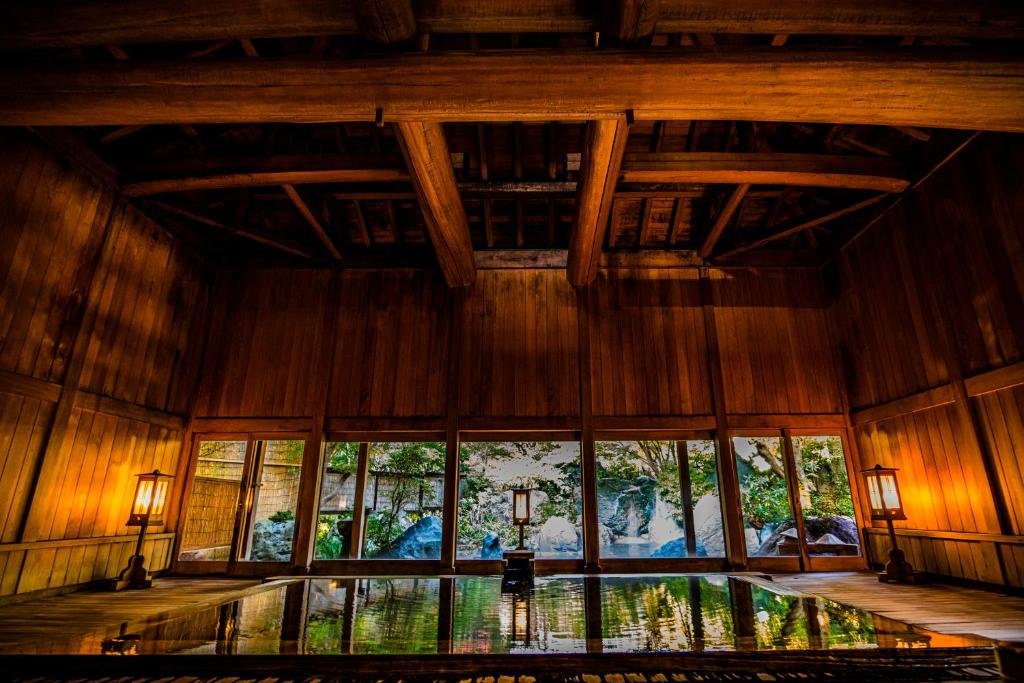 an inside view of a room with a large window at Houshi Onsen Chojukan in Minakami