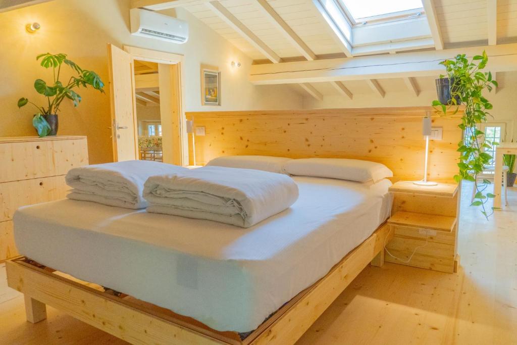 Postel nebo postele na pokoji v ubytování Agriturismo Locanda Case Vecie