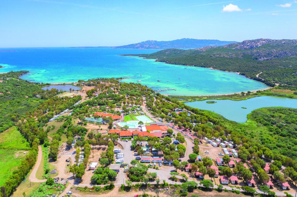 an aerial view of a resort near the water at Camping Village Capo D'Orso in Palau