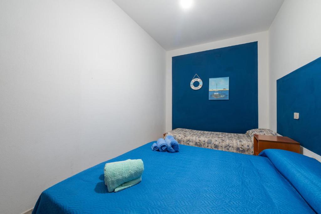Łóżko lub łóżka w pokoju w obiekcie Casa Vacanza Casi 2
