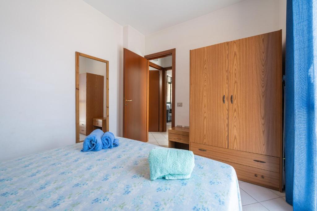 Łóżko lub łóżka w pokoju w obiekcie Casa Vacanza Casi 2