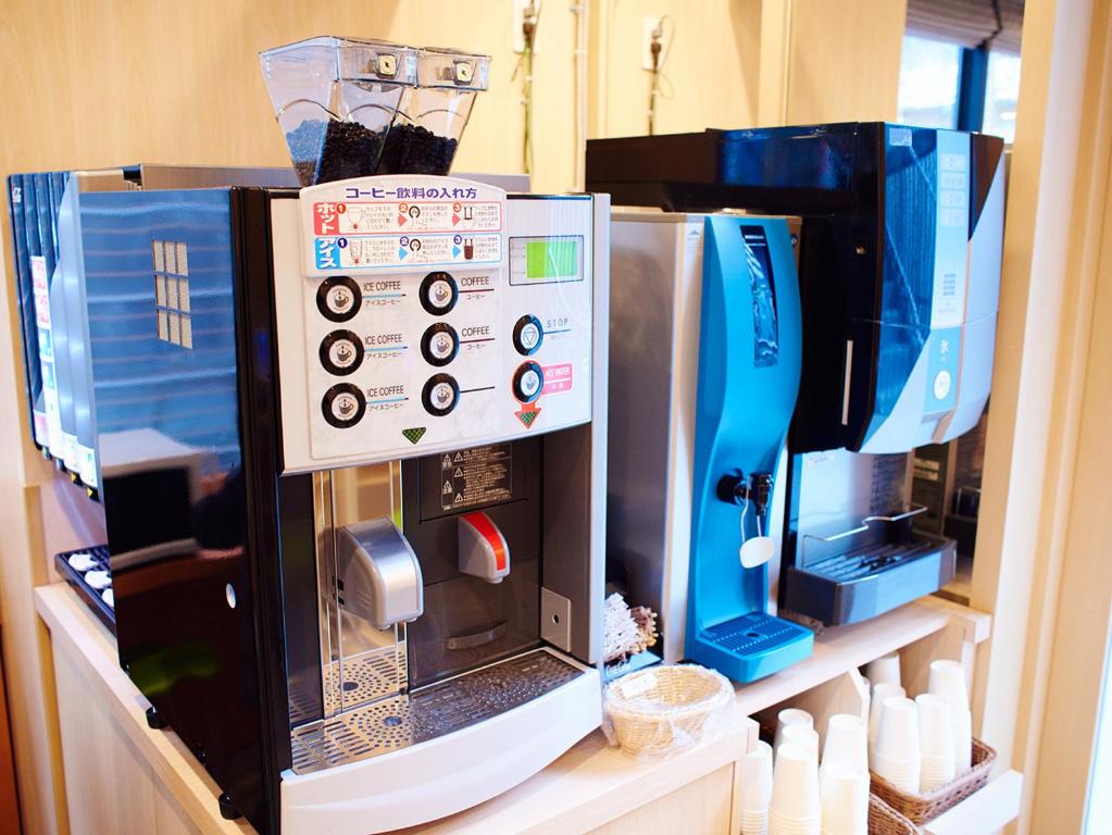 a coffee maker sitting on a shelf in a kitchen at Super Hotel Akihabara Suehirocho in Tokyo