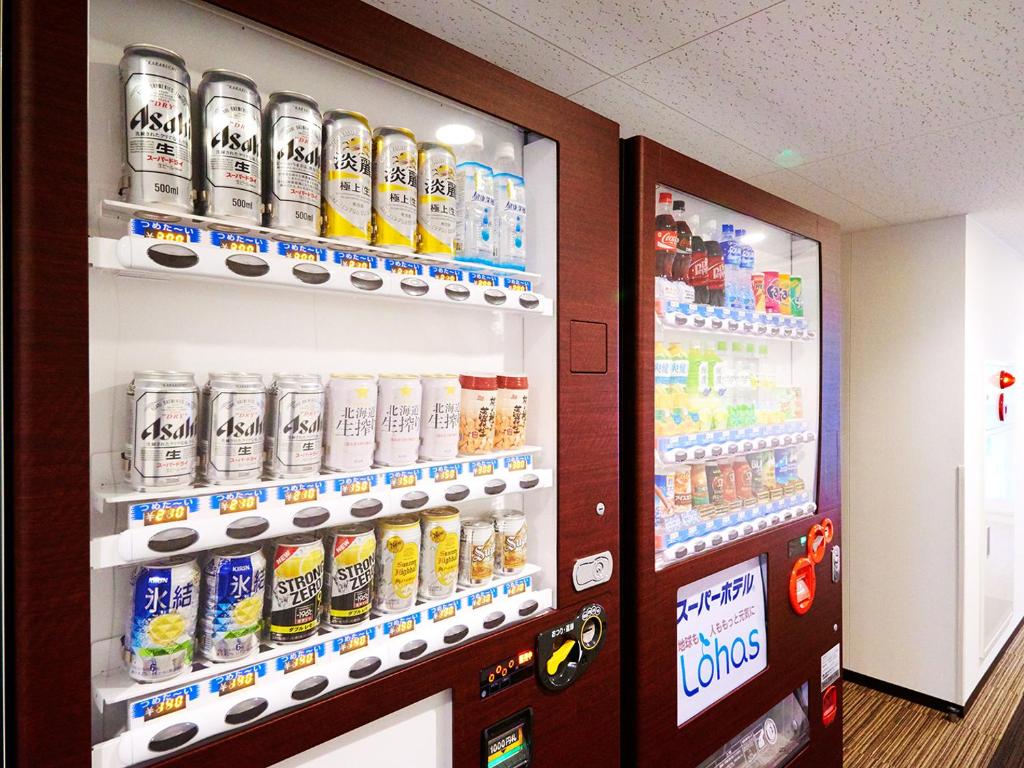 a vending machine with soda and sodas at Super Hotel Akihabara Suehirocho in Tokyo