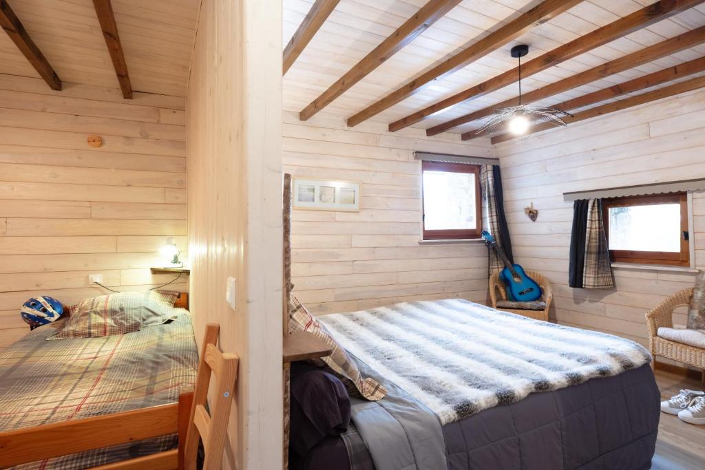 Postel nebo postele na pokoji v ubytování Chambres d'Hôtes Coeur de Bastié et Ranch du Lévézou