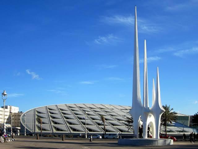 a large stadium with a building in the background at Smoha Zahran Haus (Private rooms or Private Apartment) in Alexandria