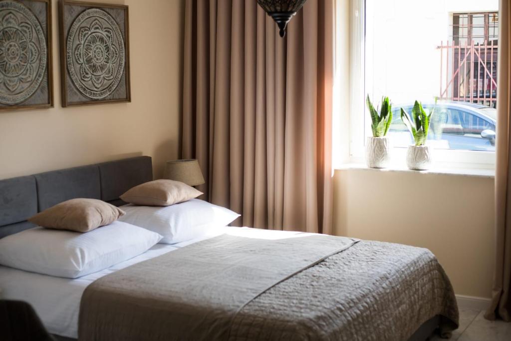 Postel nebo postele na pokoji v ubytování Apartament Miętowy Rumianek
