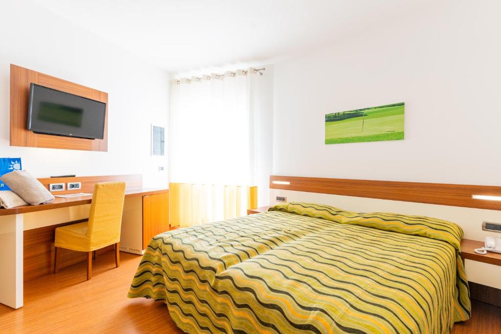 Postel nebo postele na pokoji v ubytování Hotel Maregolf