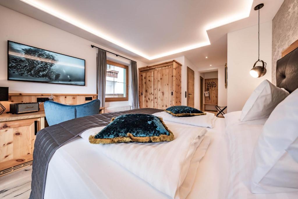 Posteľ alebo postele v izbe v ubytovaní Hotel Gasthof Perauer