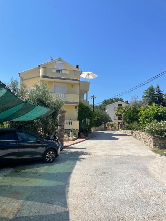 a car parked in front of a building at apartment IVA in Supetarska Draga