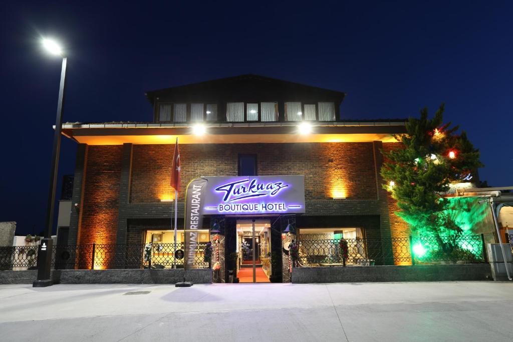 a building with a sign on the front of it at Turkuaz Boutique Hotel in Buyukcekmece