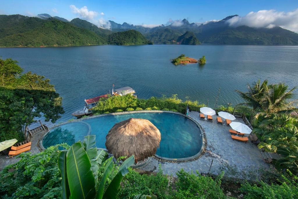 an aerial view of a large body of water at Mai Chau Hideaway Lake Resort in Mai Chau