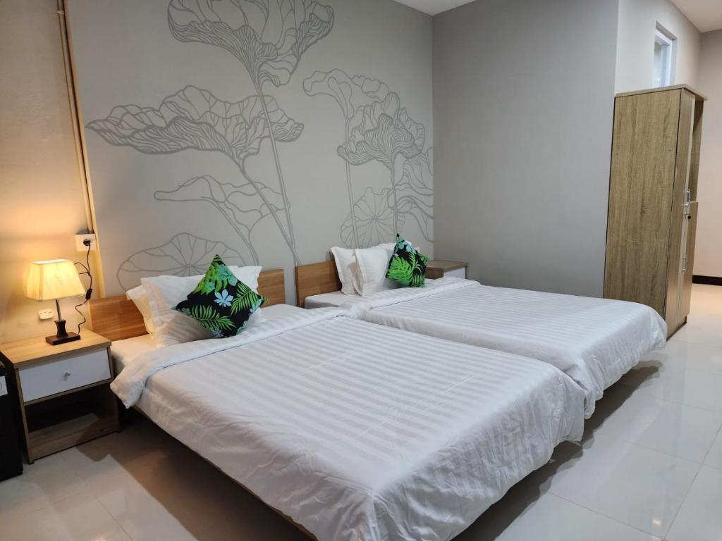 Postel nebo postele na pokoji v ubytování Hepi Yuk Ubud Luxury Guesthouse