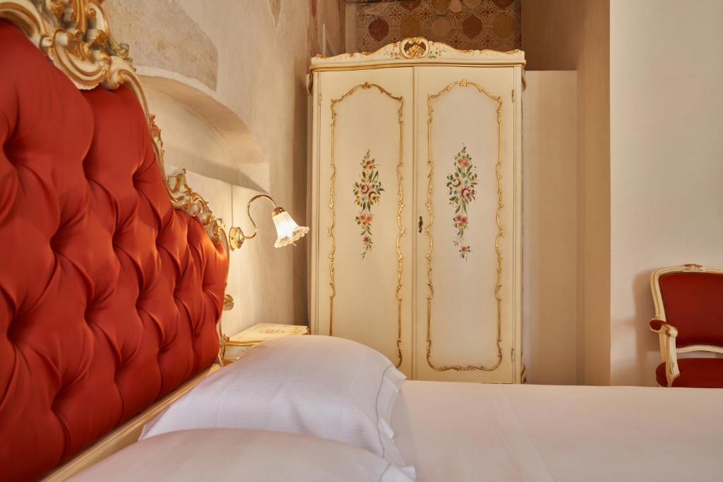 Postel nebo postele na pokoji v ubytování Villa Martin Hotel