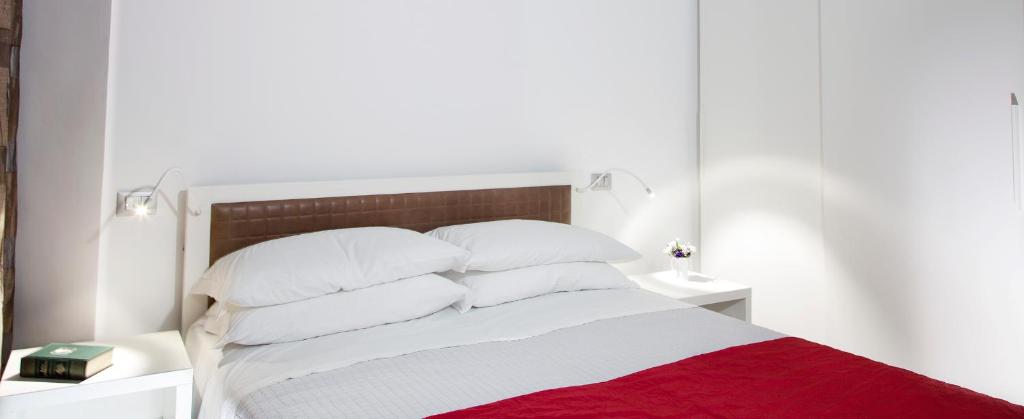 Łóżko lub łóżka w pokoju w obiekcie Iamartino Quality Rooms