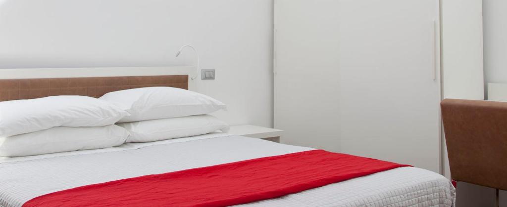 Łóżko lub łóżka w pokoju w obiekcie Iamartino Quality Rooms