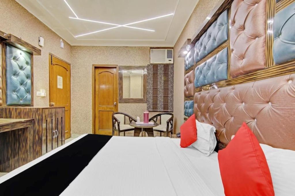 a hotel room with a bed and a desk at Hotel Red Snapper Prime in New Delhi