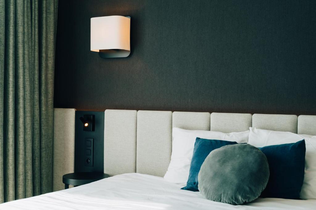 Postel nebo postele na pokoji v ubytování Factory Hotel