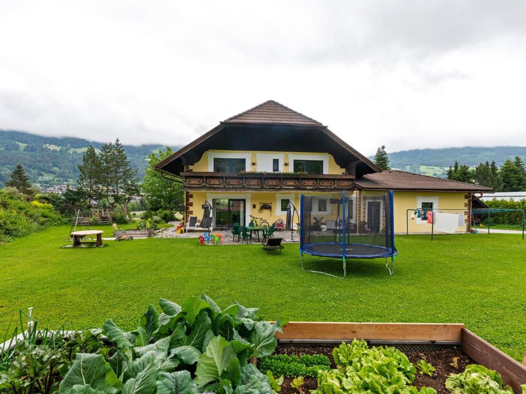 a house with a playground in the yard at Spacious Apartment in Katschberg in Sankt Michael im Lungau