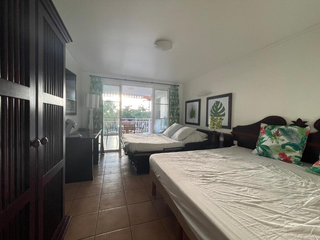 Postel nebo postele na pokoji v ubytování Appart avec piscine et vue mer - TAC