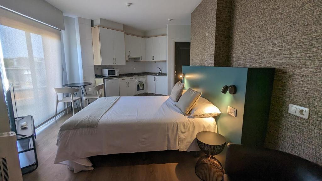 Posteľ alebo postele v izbe v ubytovaní Someso Apartamentos Turisticos