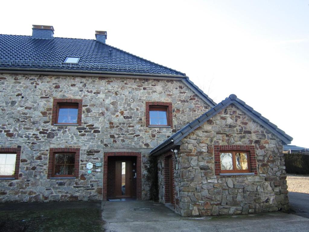 an old stone house with a front entrance at Luxury gite with sauna in Baugnez Malmedy in Arimont