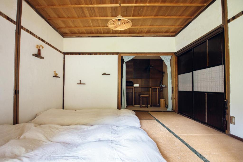 Cama o camas de una habitación en Hostel Yui-an