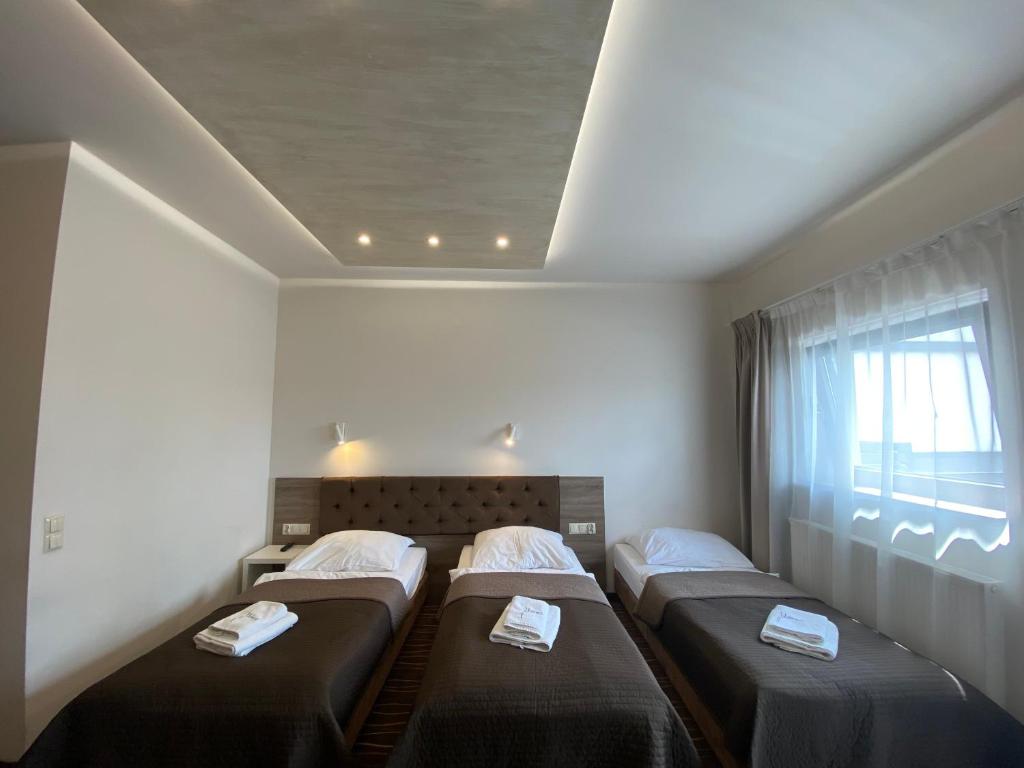 Postel nebo postele na pokoji v ubytování Hotel Wena