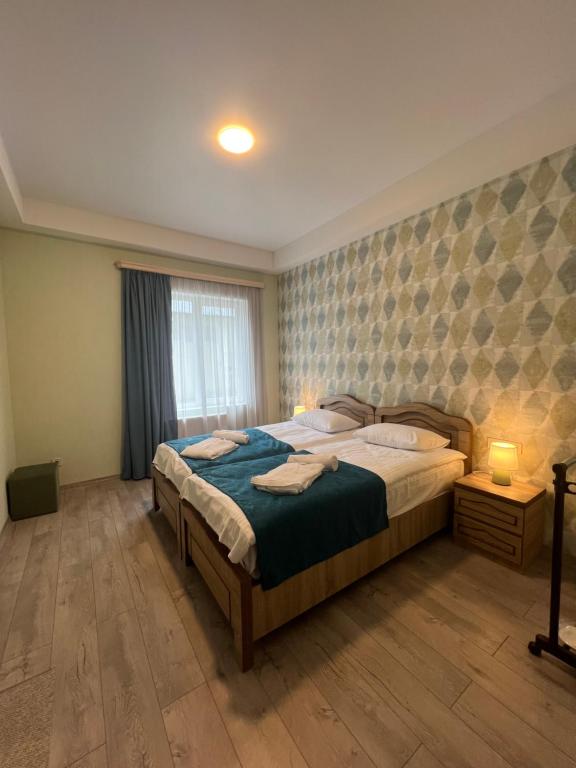 Postel nebo postele na pokoji v ubytování Planet kazbegi