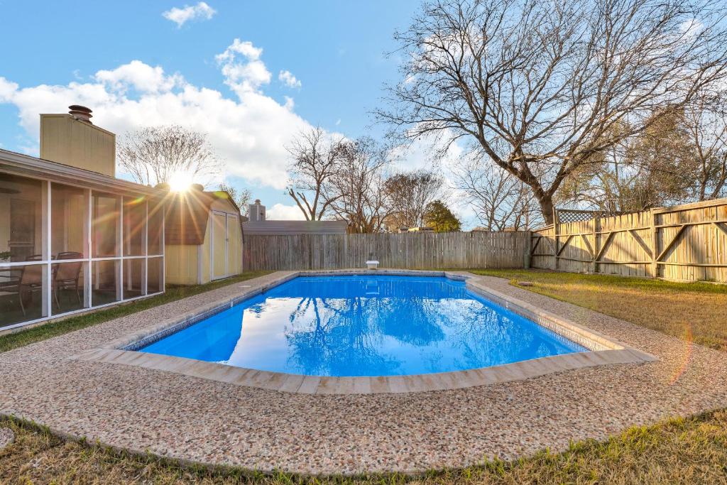 a swimming pool in the backyard of a house at King Bed Lovely Escape Mins To Seaworld Pool in San Antonio