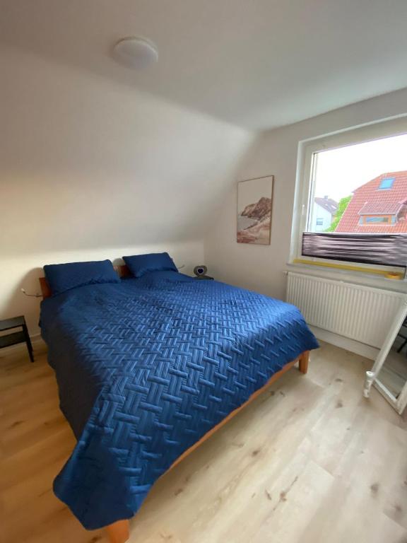 Postel nebo postele na pokoji v ubytování Haus Sunshine - Ferienwohnung Sunshine 1
