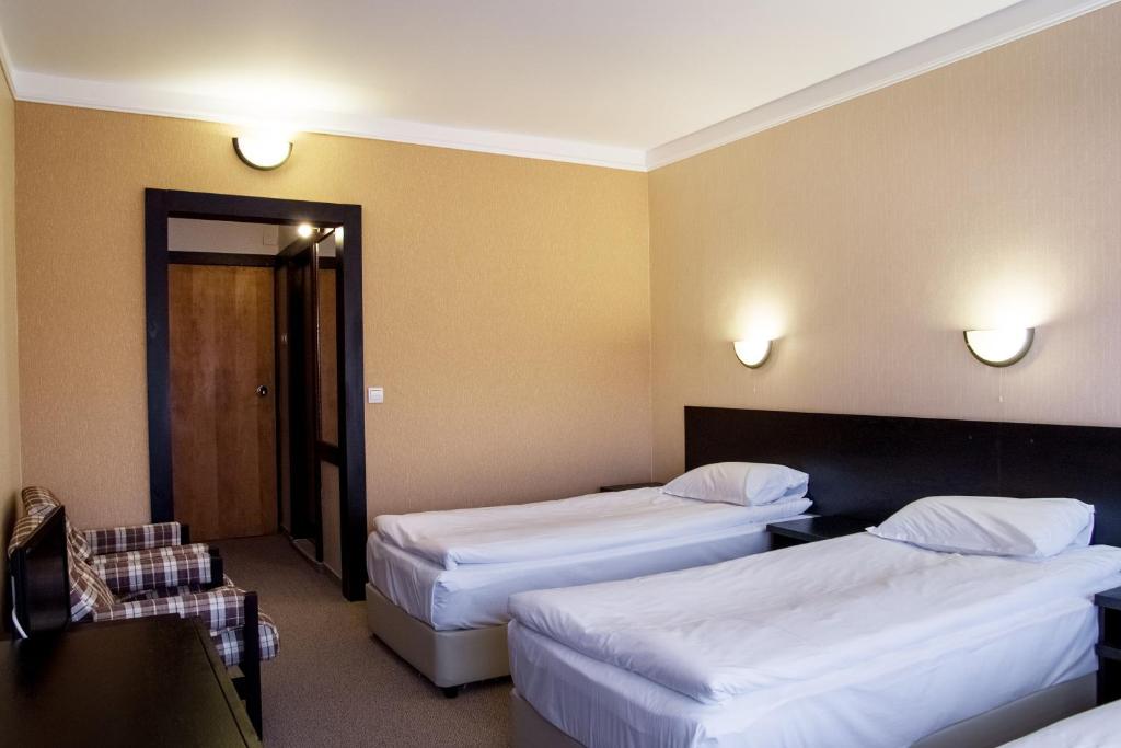 Postel nebo postele na pokoji v ubytování Everest Hotel