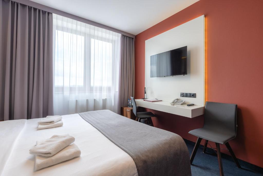 Postel nebo postele na pokoji v ubytování Terminal Hotel