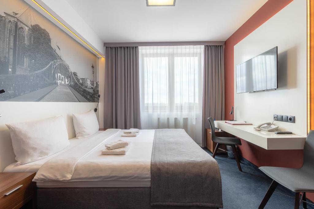 Postel nebo postele na pokoji v ubytování Terminal Hotel