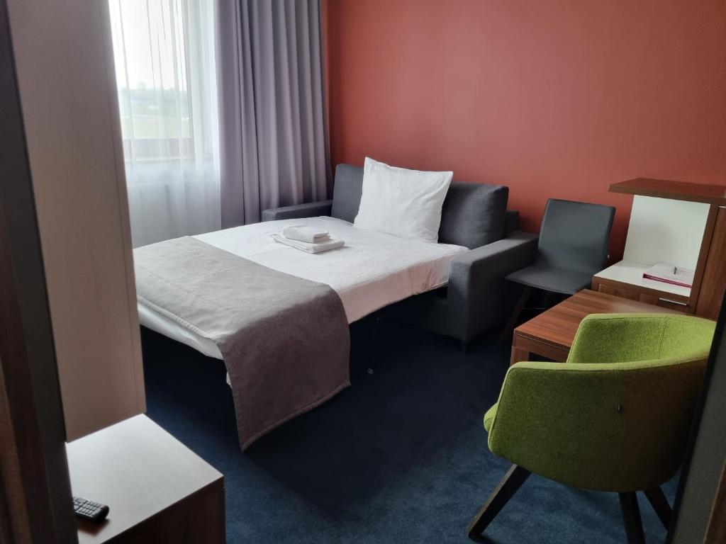 Postel nebo postele na pokoji v ubytování Terminal Hotel
