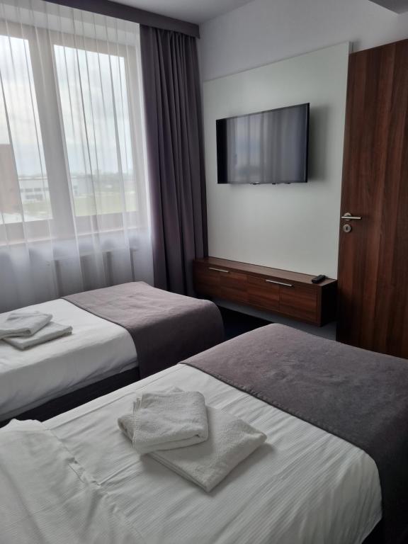 Postel nebo postele na pokoji v ubytování Terminal Hotel