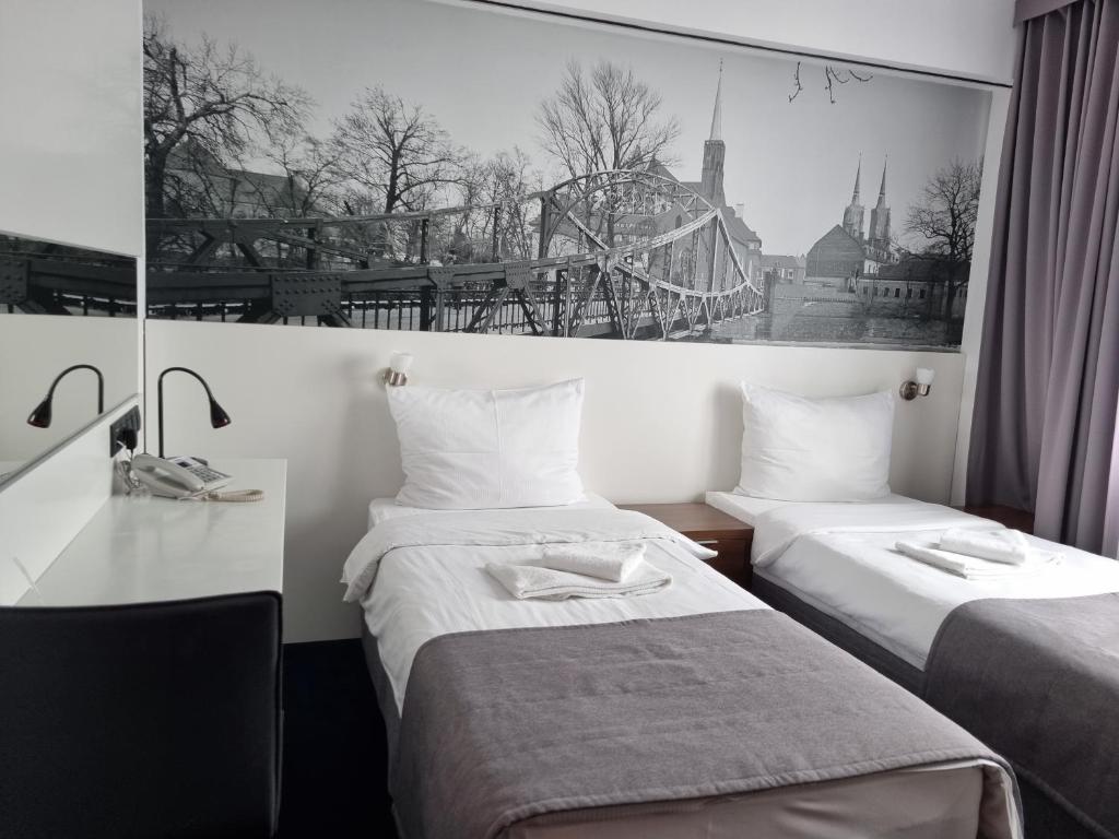 Postel nebo postele na pokoji v ubytování Terminal Hotel