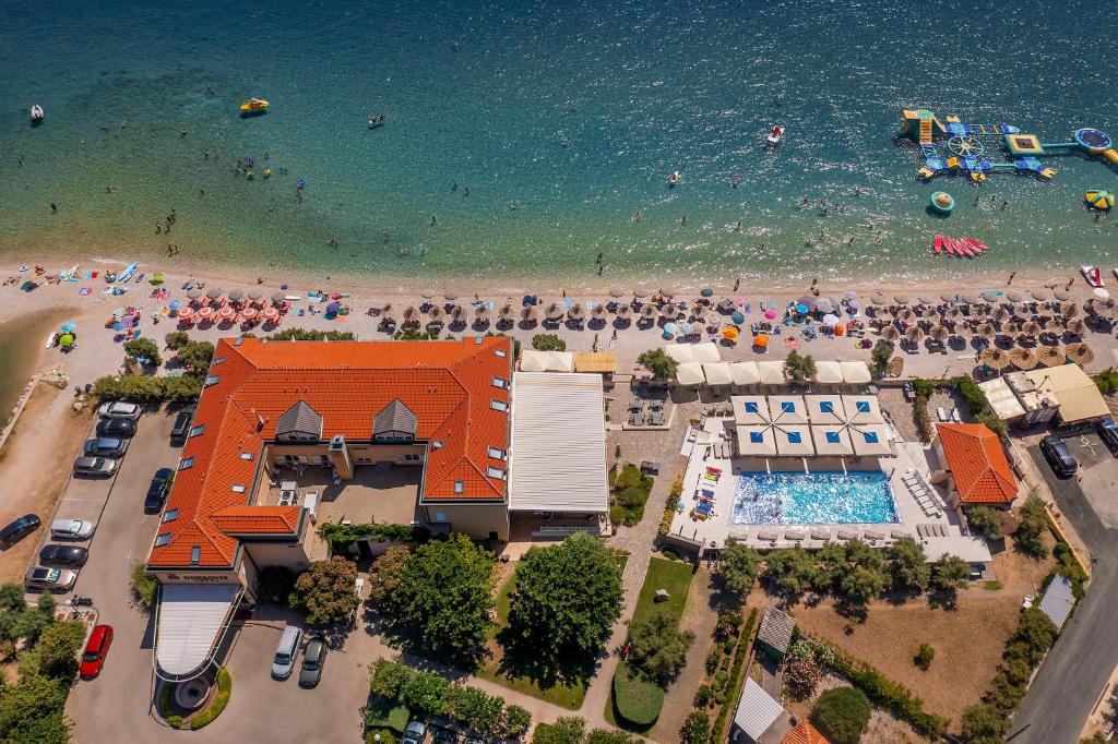 an aerial view of a beach with a crowd of people at Hotel Dobrovit ex Tamaris in Baška