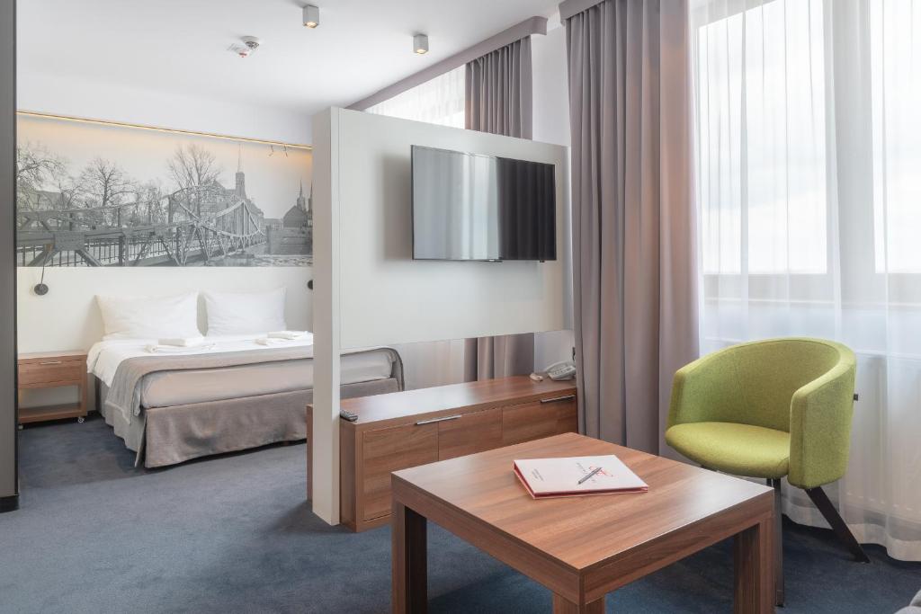 Postel nebo postele na pokoji v ubytování Terminal Hotel