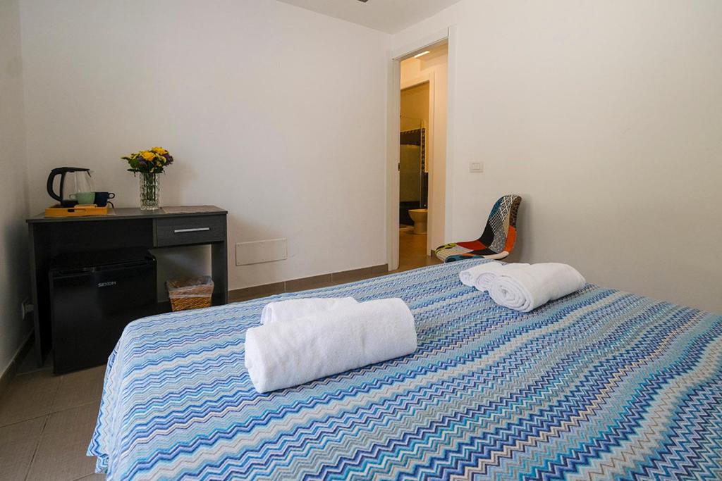 Łóżko lub łóżka w pokoju w obiekcie Numero20 B&B